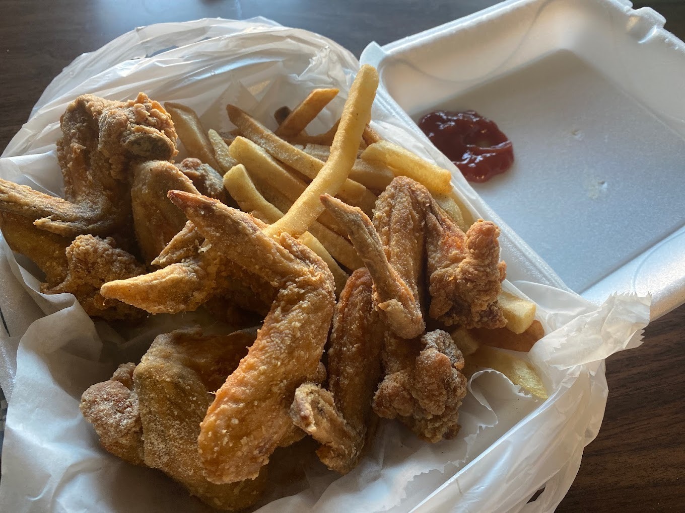 Fried chicken and fries with sauce from Naty's Fast Food on Beld Street in Madison